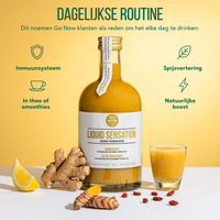 Dagelijkse routine: fles Liquid Sensation met een ingeschonken glas, gember en gojibessen op tafel