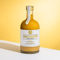 Fles Go Now Liquid Sensation 500ml tegen een gele achtergrond